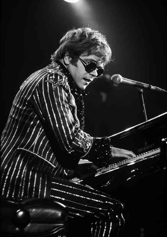 Elton John playing piano